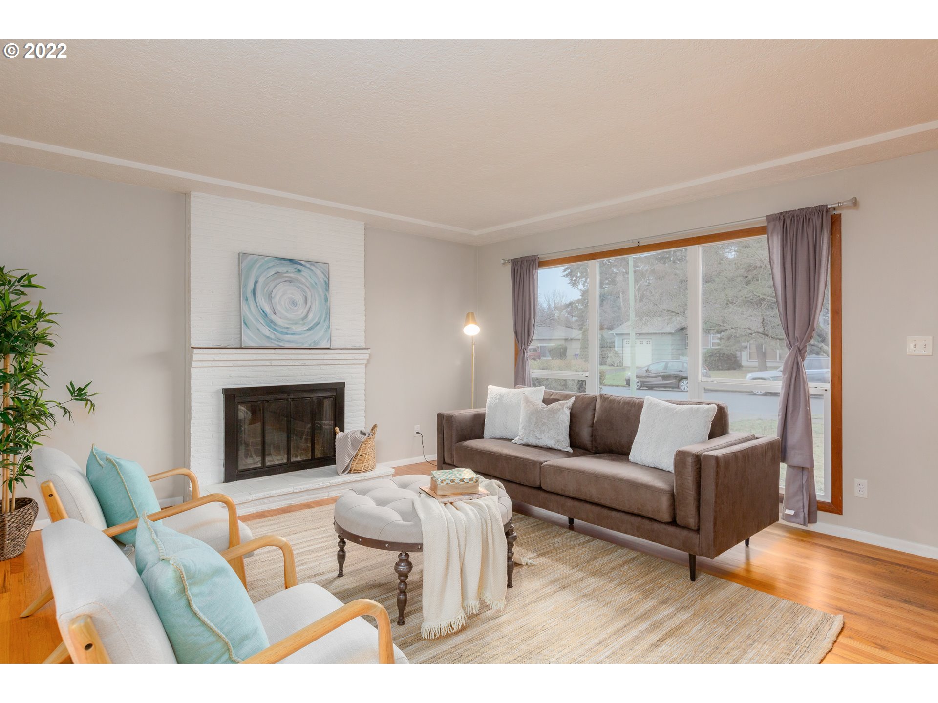 12015 Northeast Morris Street Portland, OR 97220 - Photo 3 of 23 a living room with furniture and a fireplace