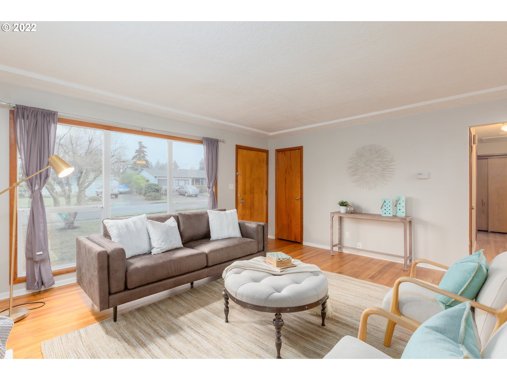 12015 Northeast Morris Street Portland, OR 97220 - Photo 4 of 23 a living room with furniture and a large window