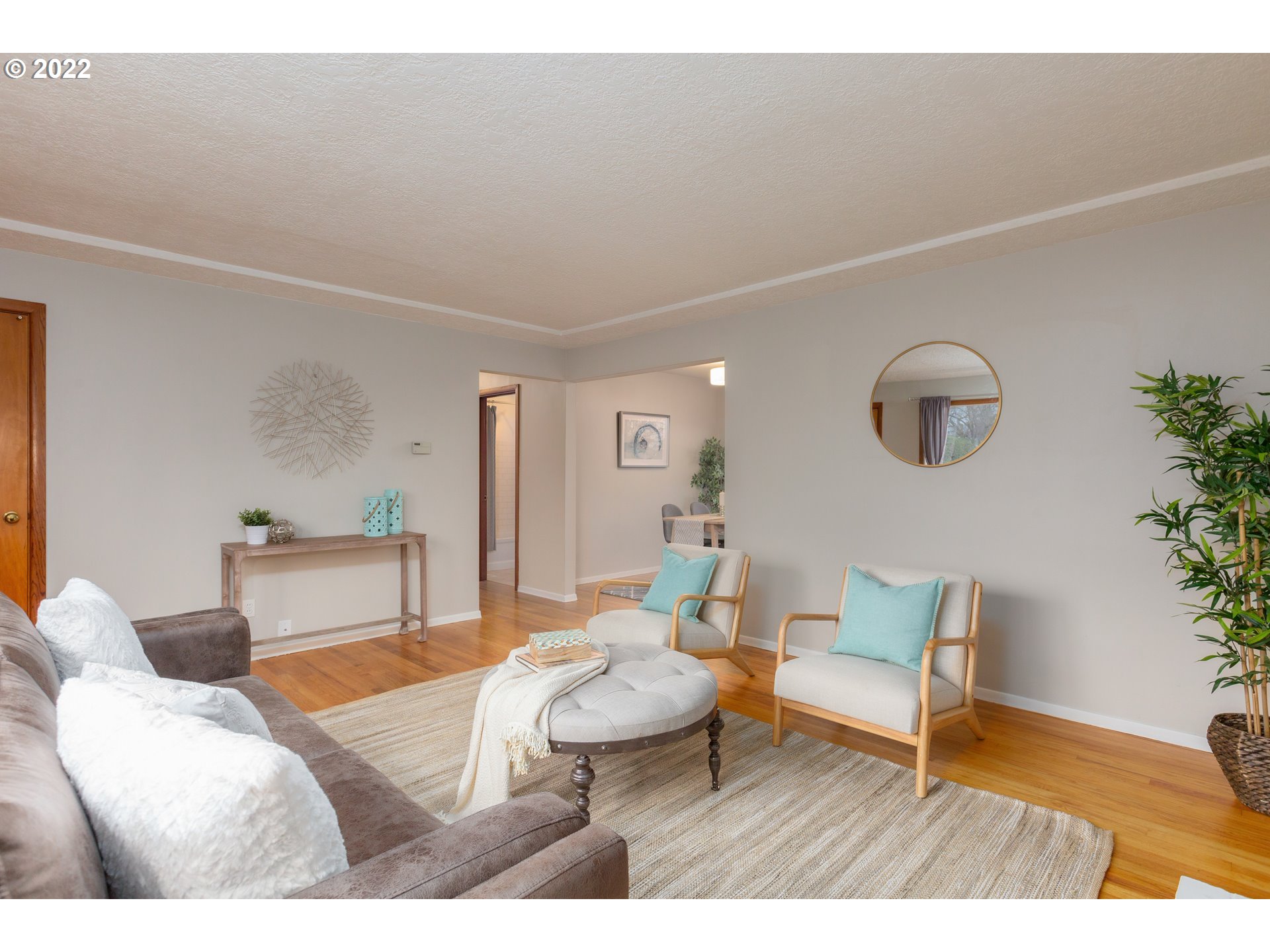12015 Northeast Morris Street Portland, OR 97220 - Photo 5 of 23 a living room with furniture and a potted plant