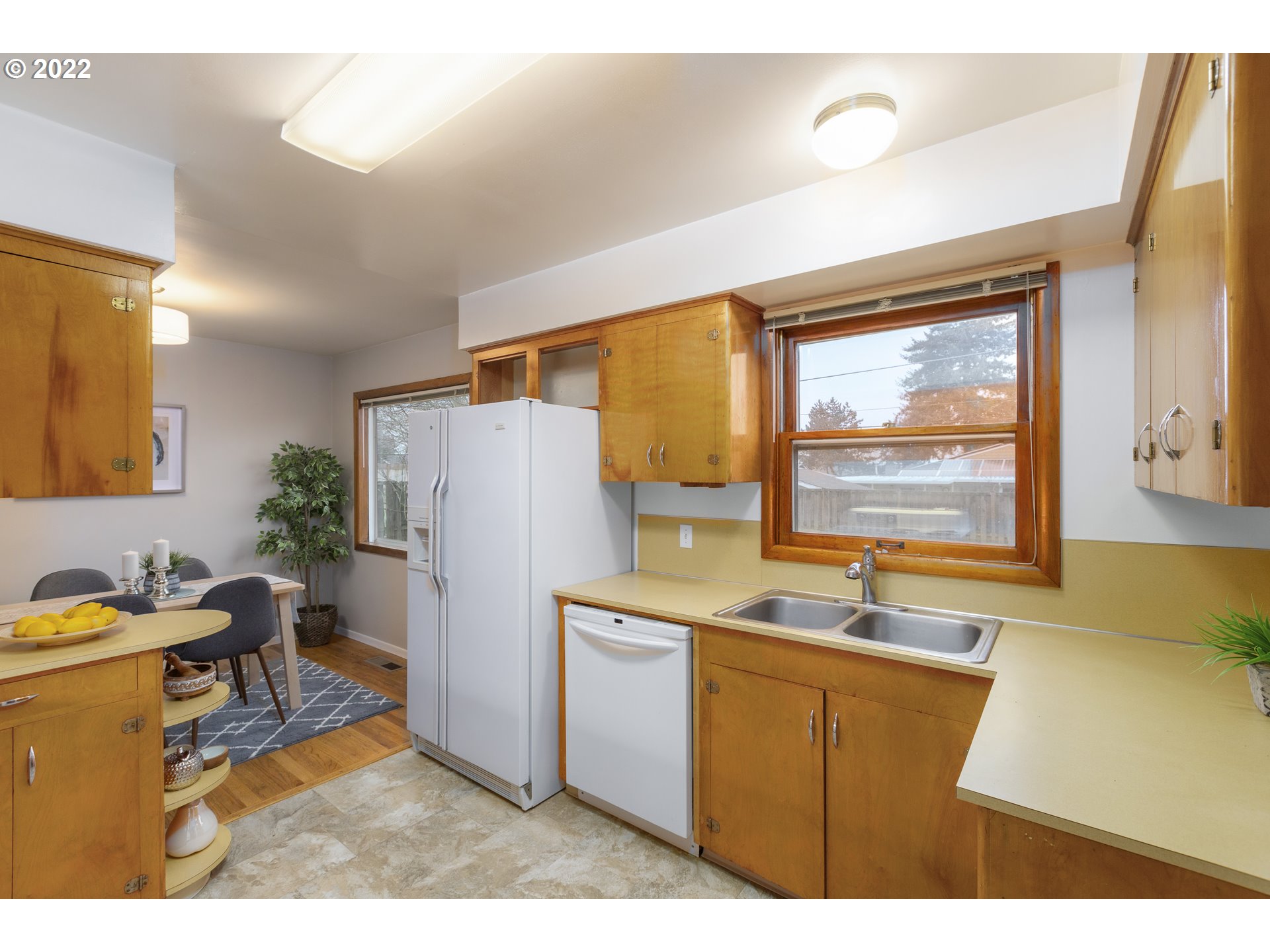 12015 Northeast Morris Street Portland, OR 97220 - Photo 9 of 23 a kitchen with a sink appliances and a window