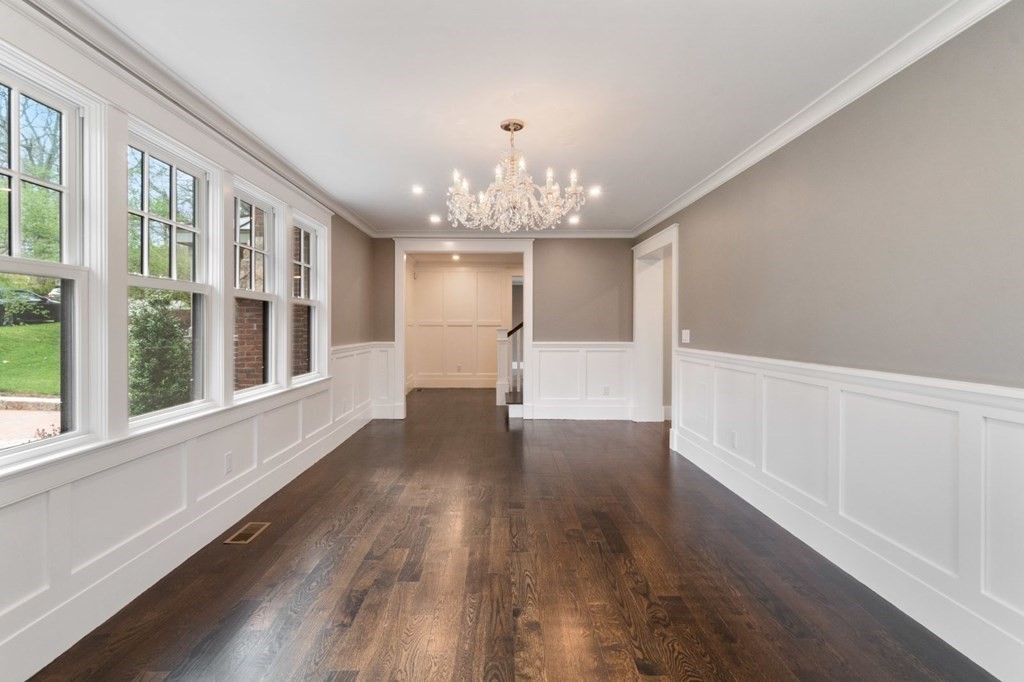 5 Rockridge Road Wellesley, MA 02481 - Photo 8 of 41 a view of an empty room with wooden floor and a window