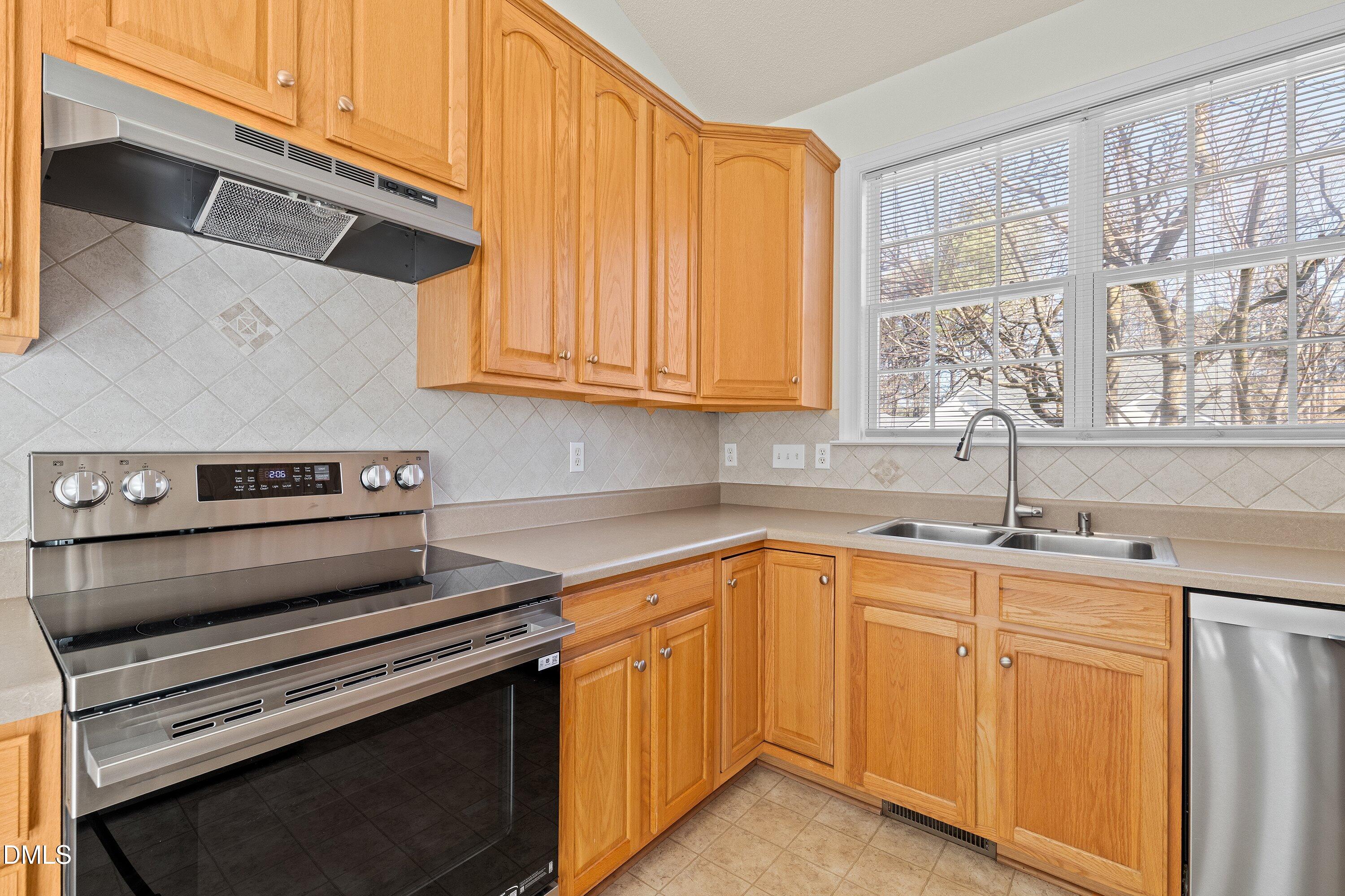 105 Rockport Ridge Way Cary, NC 27519 - Photo 6 of 43 a kitchen with a sink and cabinets
