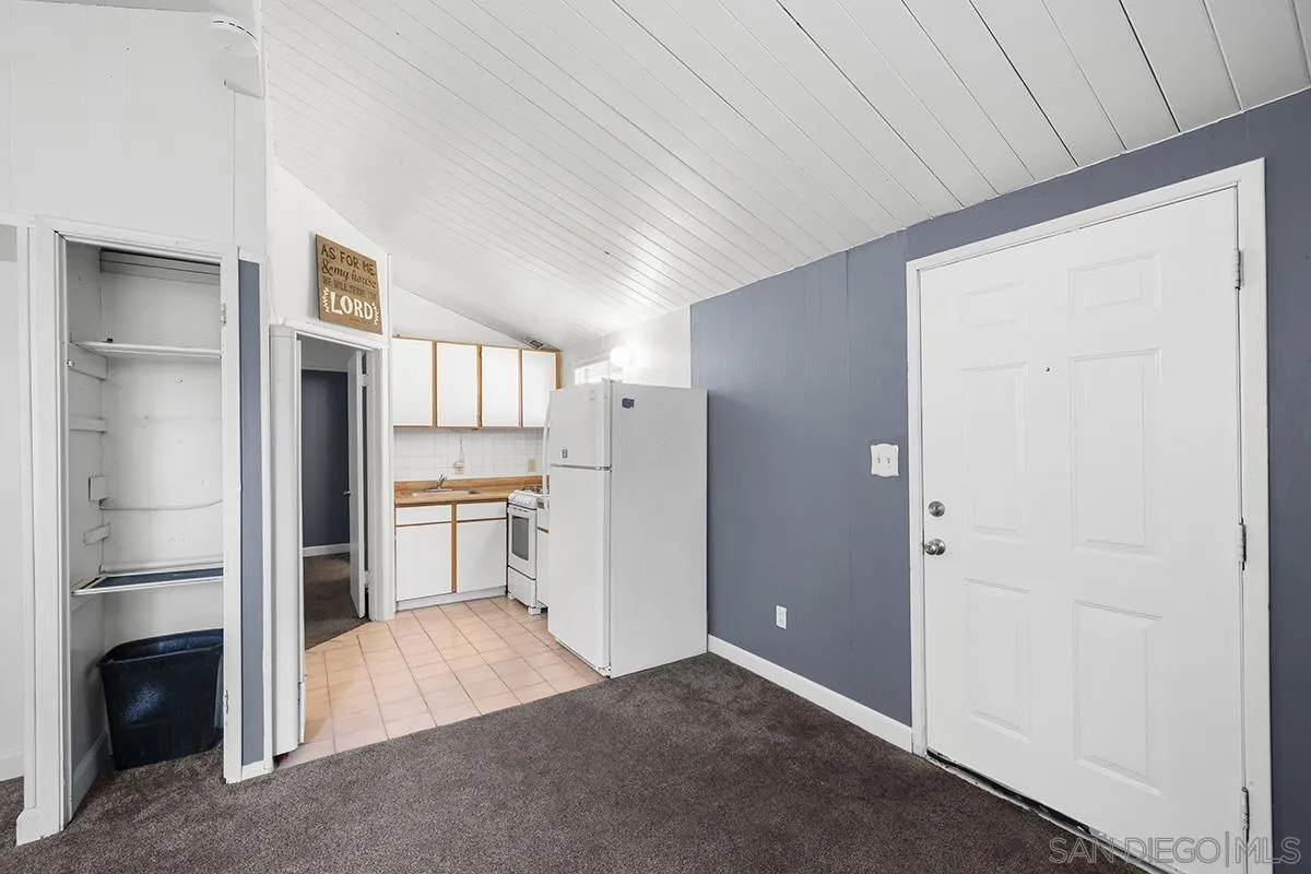 5616 Riley Street San Diego, CA 92110 - Photo 15 of 22 a view of kitchen with furniture and a refrigerator