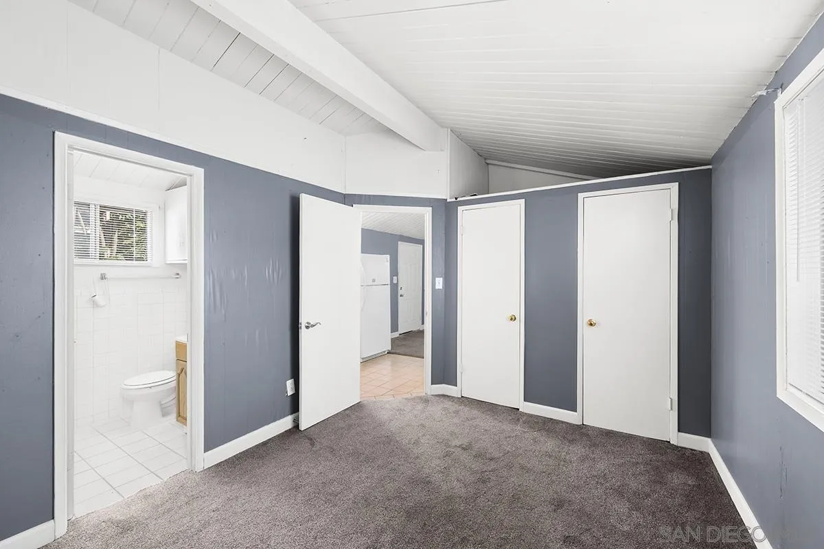 5616 Riley Street San Diego, CA 92110 - Photo 20 of 22 a view of a big room with closet and windows