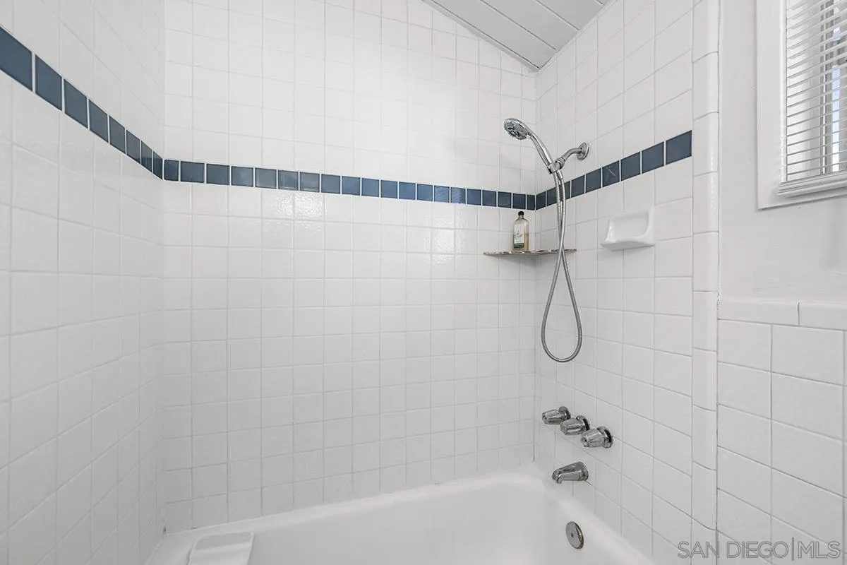 5616 Riley Street San Diego, CA 92110 - Photo 21 of 22 a bathroom with a shower and a bathtub