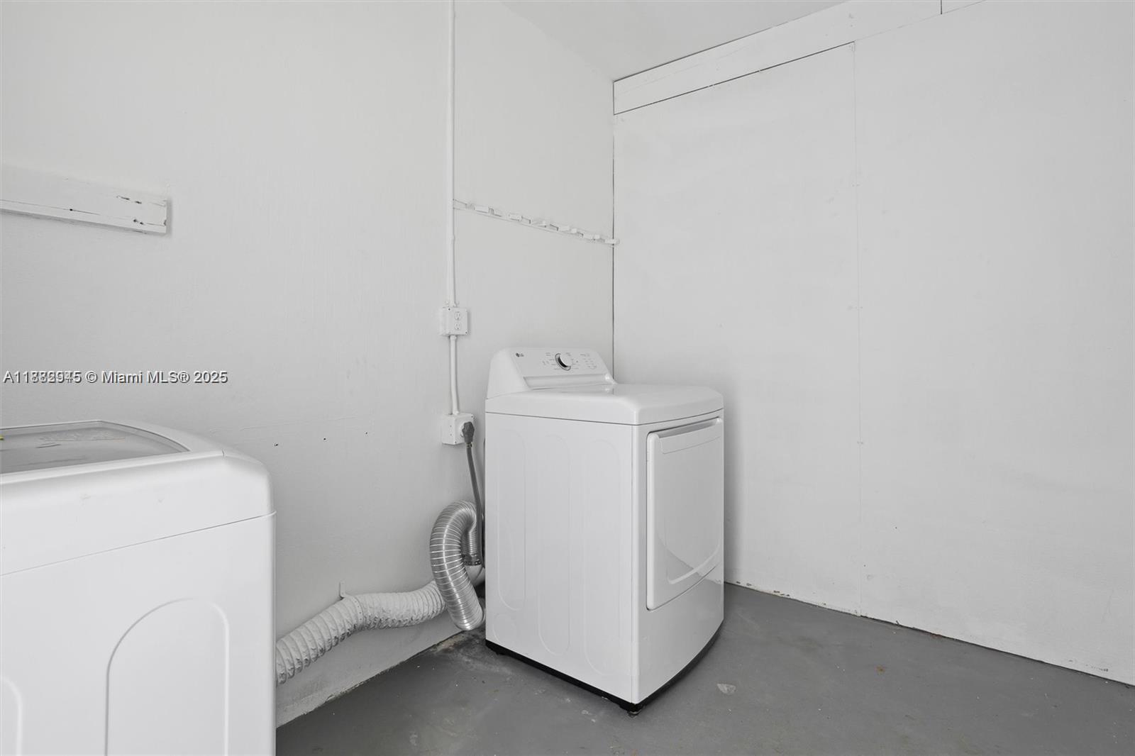 70 Northeast 186th Terrace Miami, FL 33179 - Photo 26 of 32 a utility room with dryer and washer