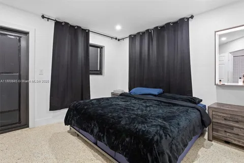 a bedroom with a bed and a closet