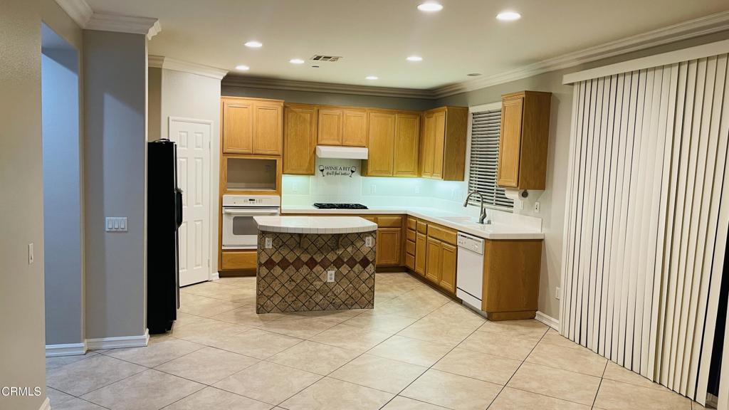 350 Huerta Street Oxnard, CA 93030 - Photo 8 of 11 a dining hall with stainless steel appliances a sink a counter top space and a large window
