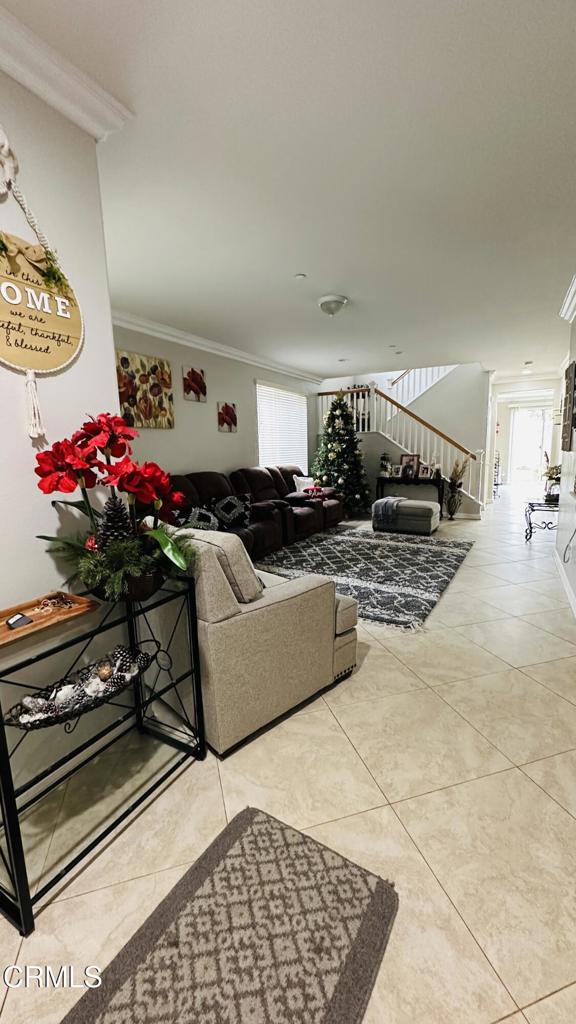 350 Huerta Street Oxnard, CA 93030 - Photo 10 of 11 a living room with furniture gym equipment and a rug