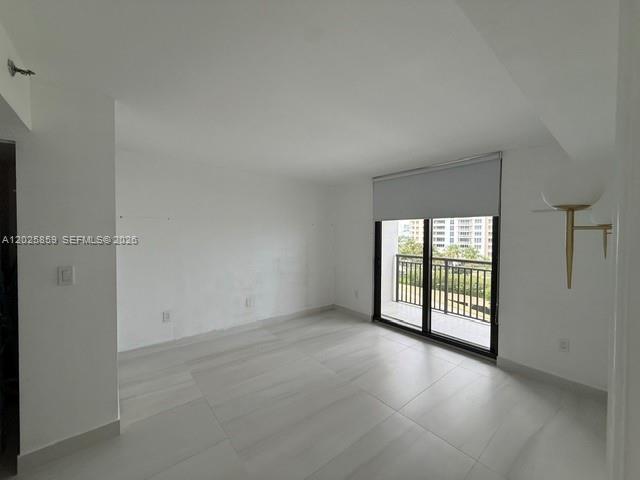 540 Brickell Key Drive, Unit 1024 Miami, FL 33131 - Photo 17 of 28 an empty room with windows