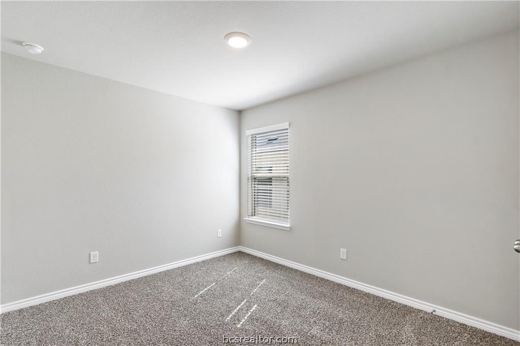 2119 Chief Street Bryan, TX 77807 - Photo 12 of 23 a view of an empty room with a window