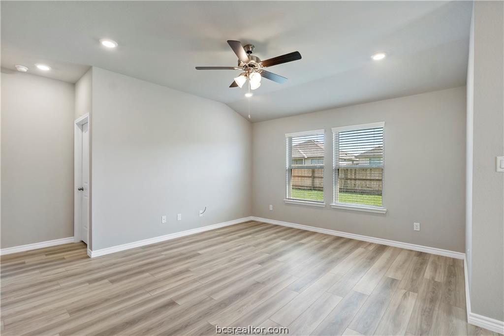 2119 Chief Street Bryan, TX 77807 - Photo 16 of 23 a view of an empty room with wooden floor and a window