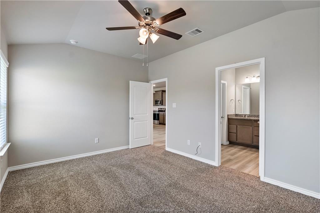 2119 Chief Street Bryan, TX 77807 - Photo 19 of 23 an empty room with a ceiling fan and a window