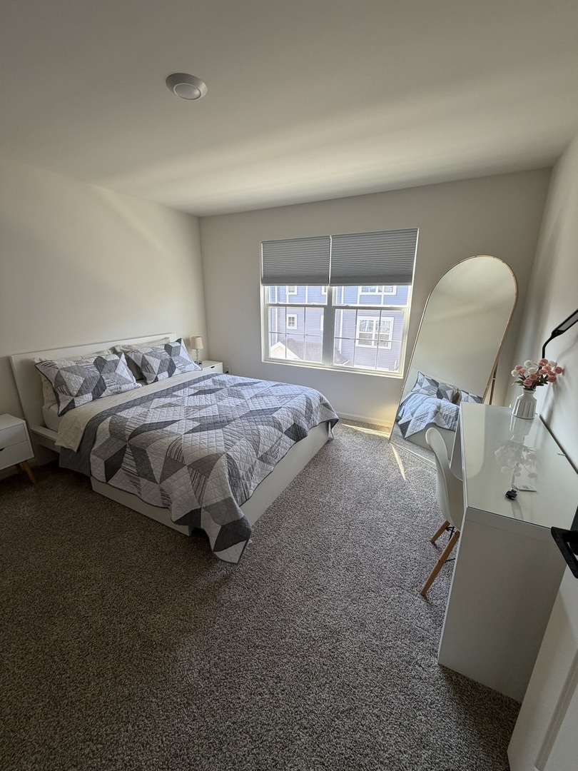 1555 Sequoia Way Pingree Grove, IL 60140 - Photo 12 of 17 a bed sitting in a room next to a window