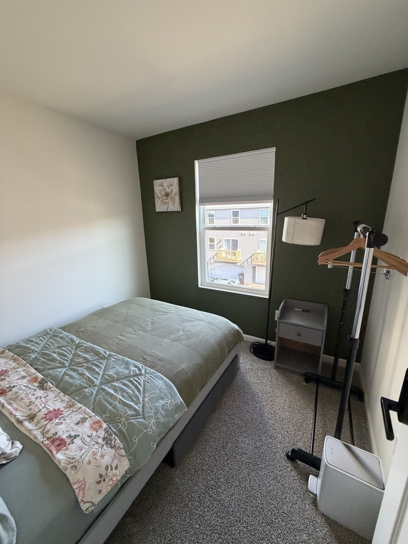 1555 Sequoia Way Pingree Grove, IL 60140 - Photo 10 of 17 a bedroom with a bed and a window