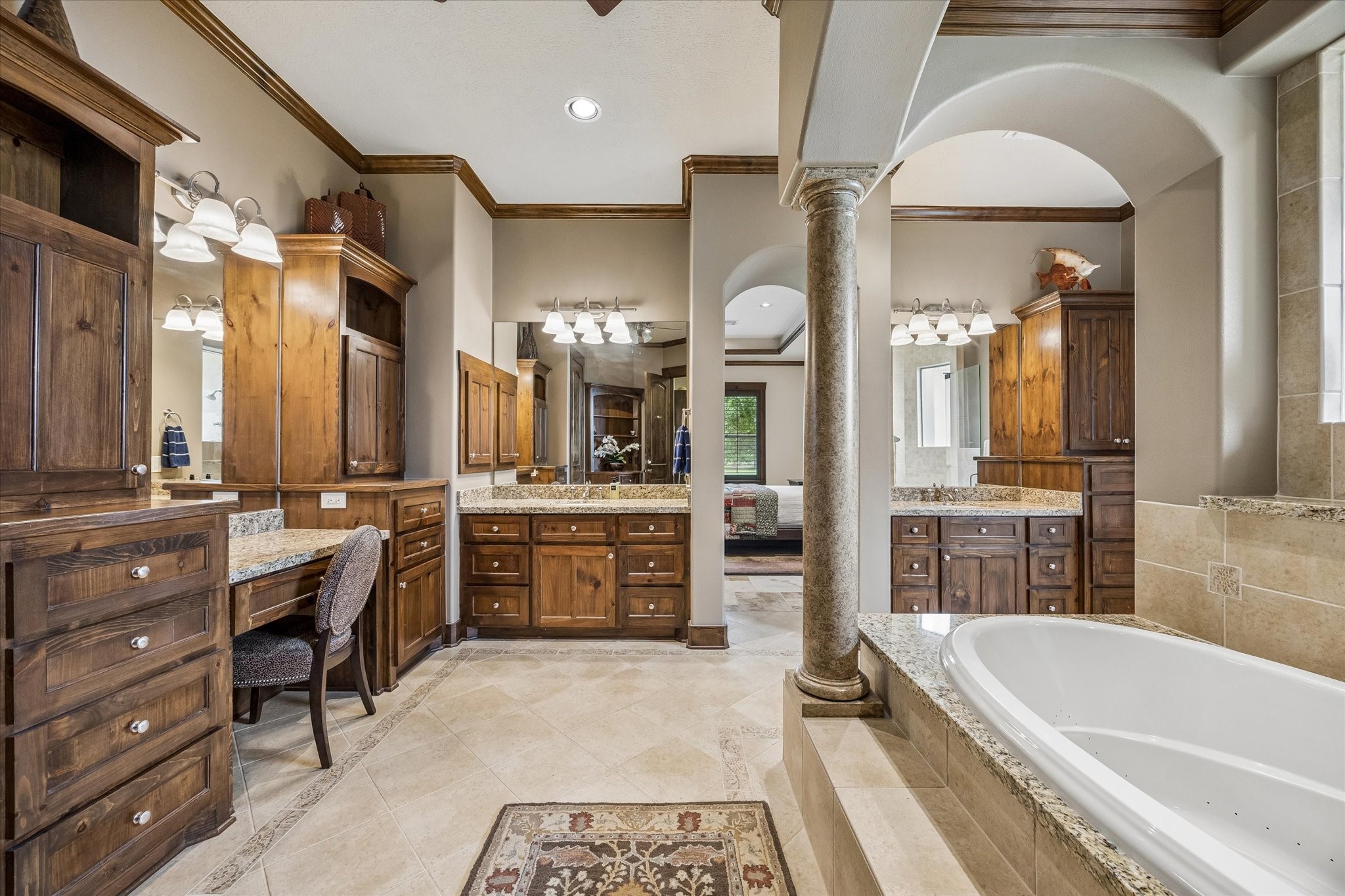 32102 Fulbrook Commons Fulshear, TX 77441 - Photo 19 of 50 Designed with comfort in mind, the luxurious bath features dual vanities, extensive storage, and refined finishes throughout.