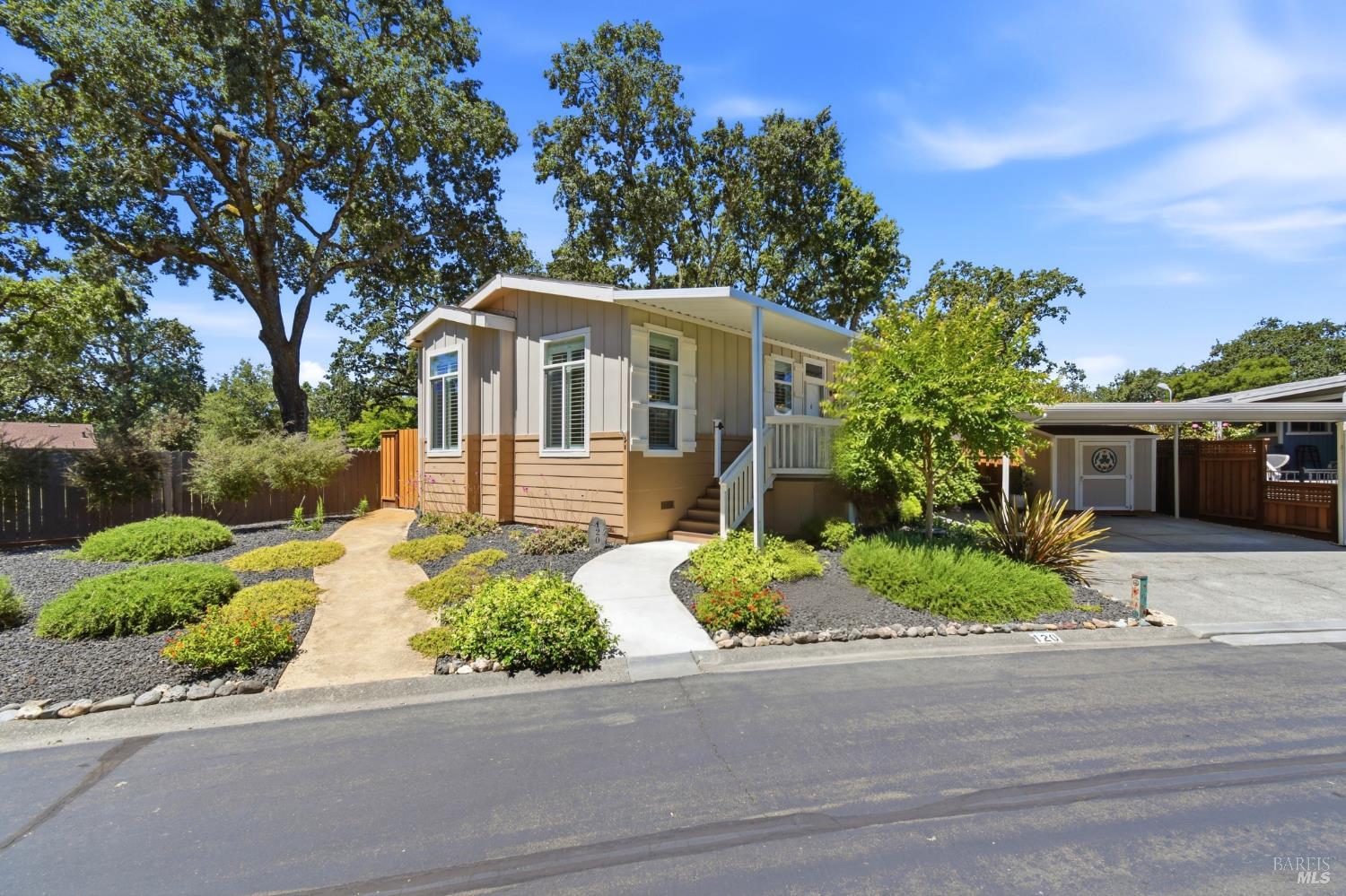 120 Shamrock Circle Santa Rosa, CA 95403 - Photo 6 of 45 a front view of a house with a yard and potted plants