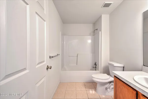 a bathroom with a sink a toilet and bathtub