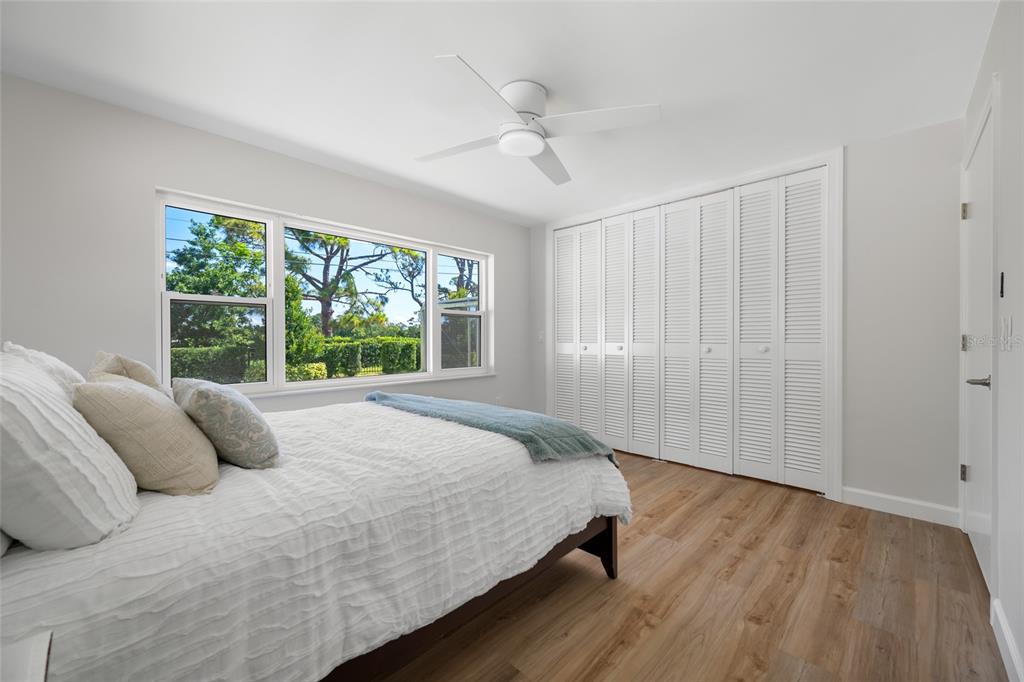 656 Mehlenbacher Road Belleair, FL 33756 - Photo 27 of 49 a bedroom with a bed and a window