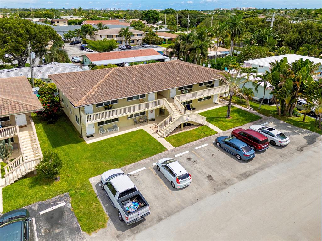 2131 Northeast 40th Court, Unit 18 Lighthouse Point, FL 33064 - Photo 33 of 36 an aerial view of a house with backyard space and balcony