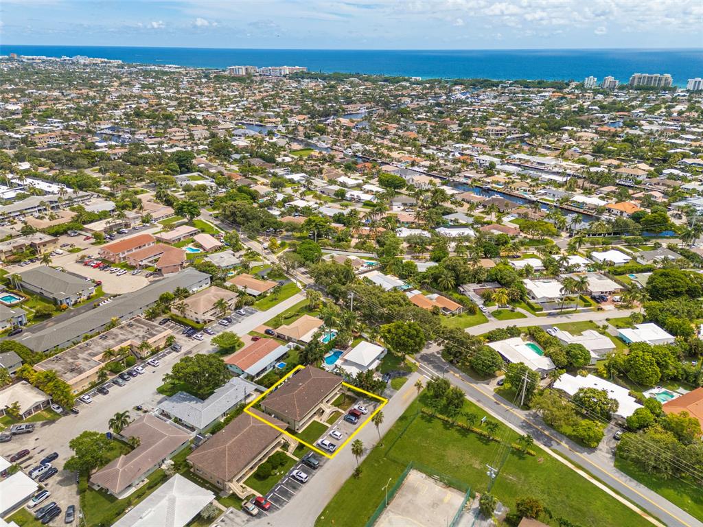 2131 Northeast 40th Court, Unit 18 Lighthouse Point, FL 33064 - Photo 35 of 36 an aerial view of residential houses with outdoor space