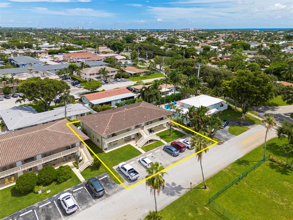 2131 Northeast 40th Court, Unit 18 Lighthouse Point, FL 33064 - Photo 36 of 36 an aerial view of a house with a garden