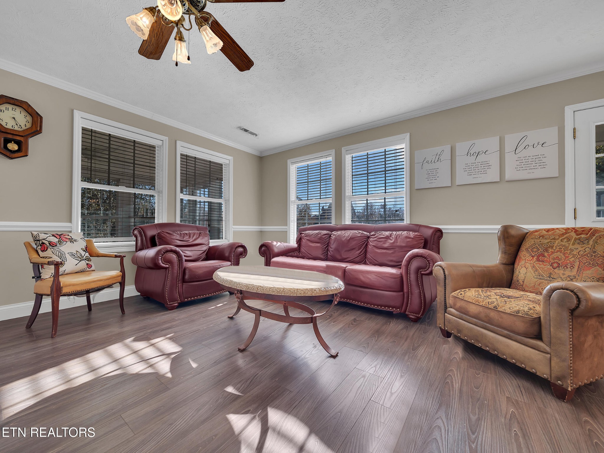 9256 Hines Valley Road Lenoir City, TN 37771 - Photo 11 of 46 a living room with furniture ceiling fan and a window