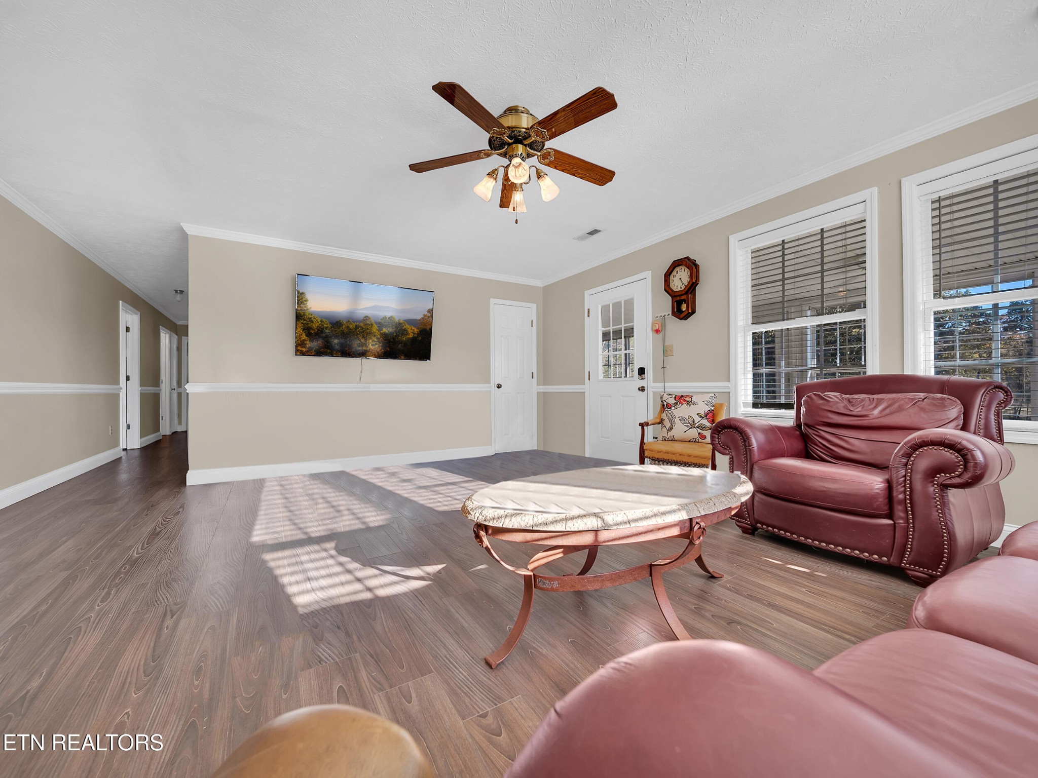 9256 Hines Valley Road Lenoir City, TN 37771 - Photo 12 of 46 a living room with furniture a window and a ceiling fan