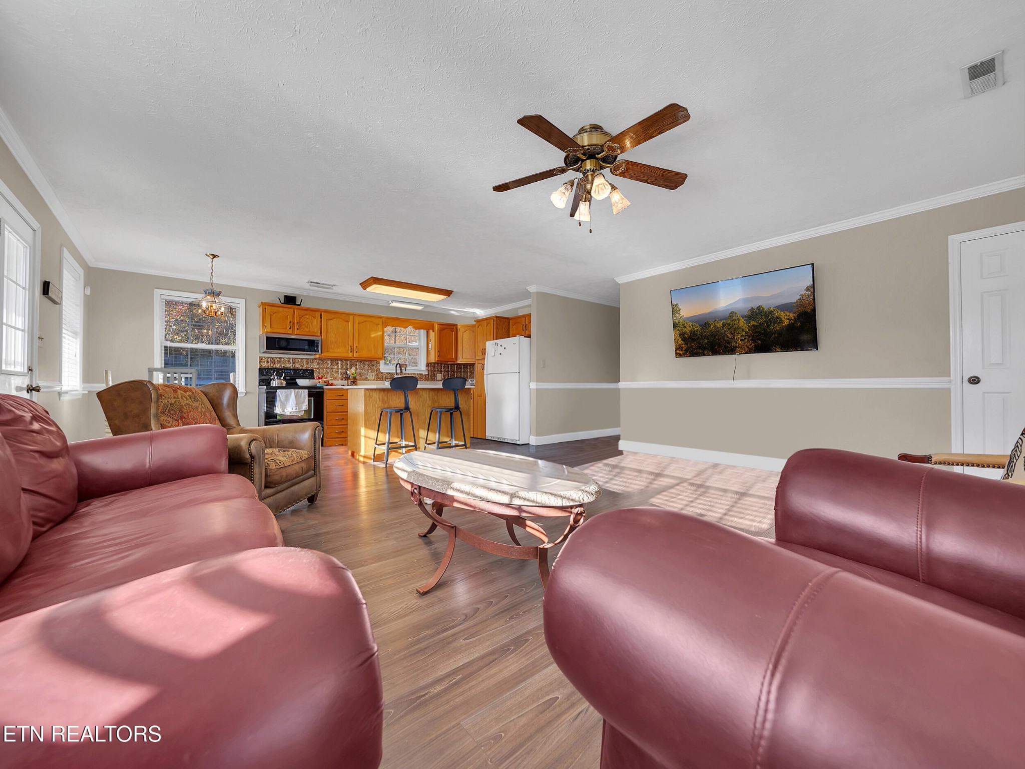 9256 Hines Valley Road Lenoir City, TN 37771 - Photo 14 of 46 a living room with furniture and wooden floor