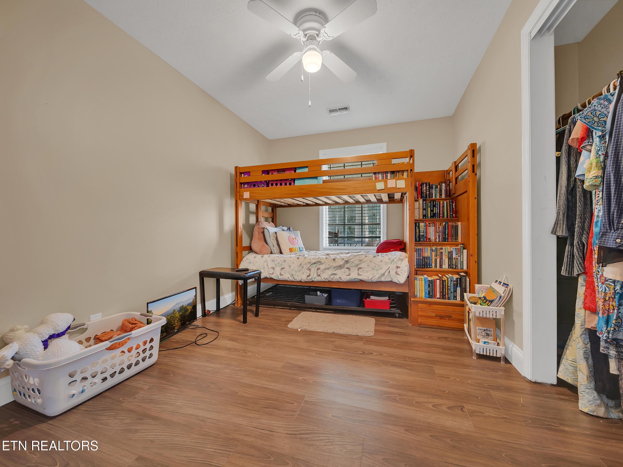 9256 Hines Valley Road Lenoir City, TN 37771 - Photo 22 of 46 a bedroom with furniture and wooden floor