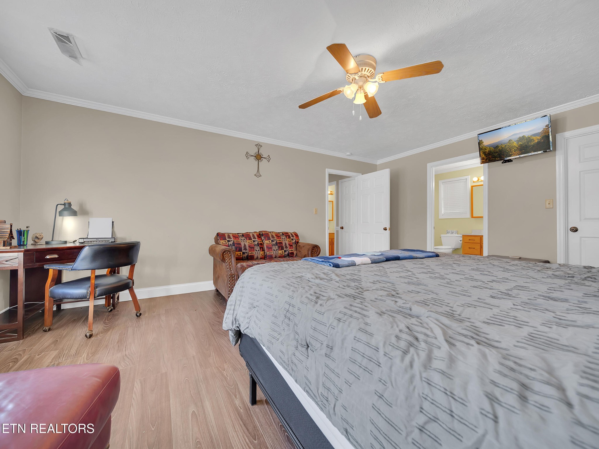 9256 Hines Valley Road Lenoir City, TN 37771 - Photo 28 of 46 a bed room with a bed and a chair