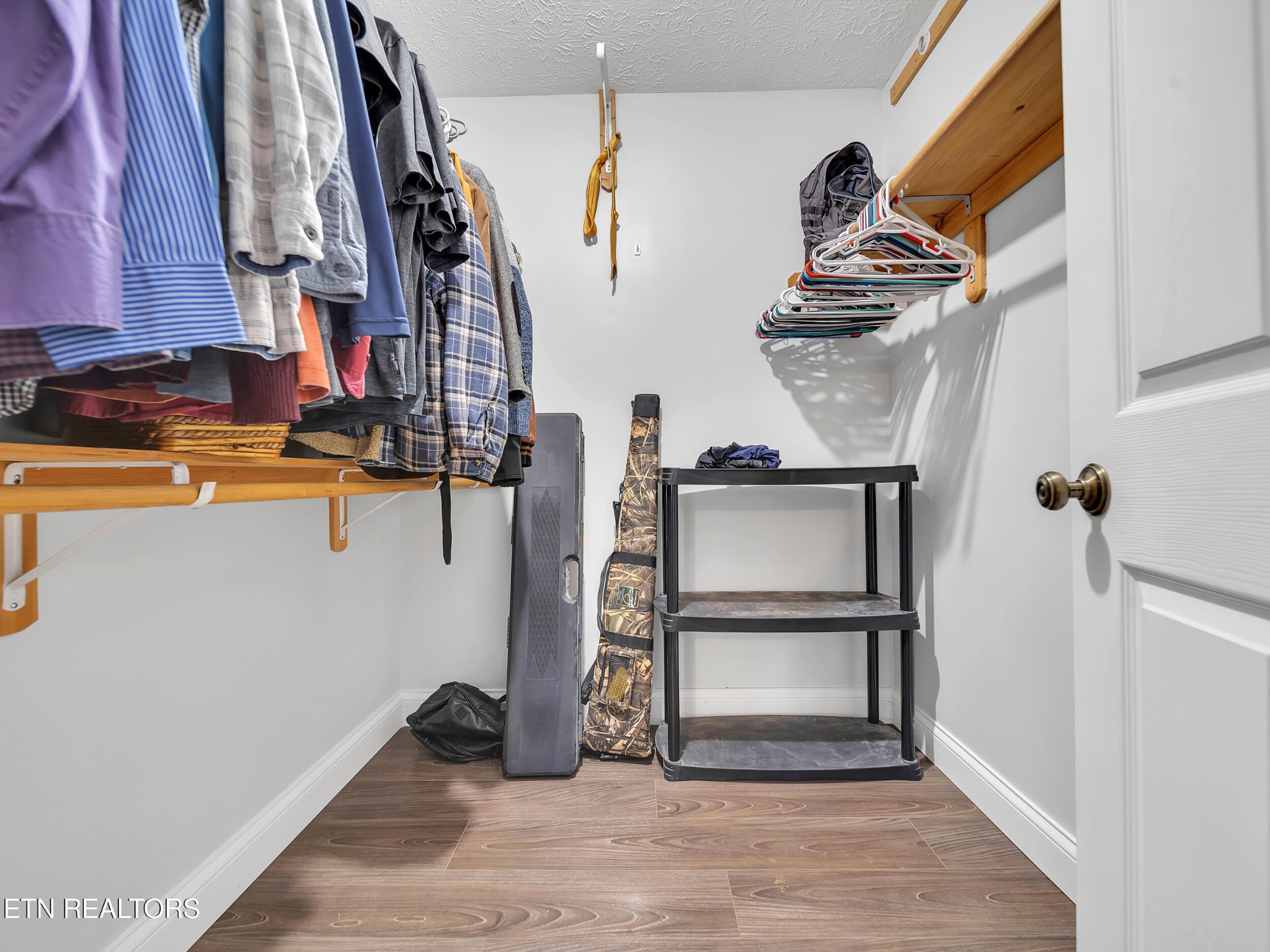 9256 Hines Valley Road Lenoir City, TN 37771 - Photo 29 of 46 a view of walk in closet with clothes and shoes