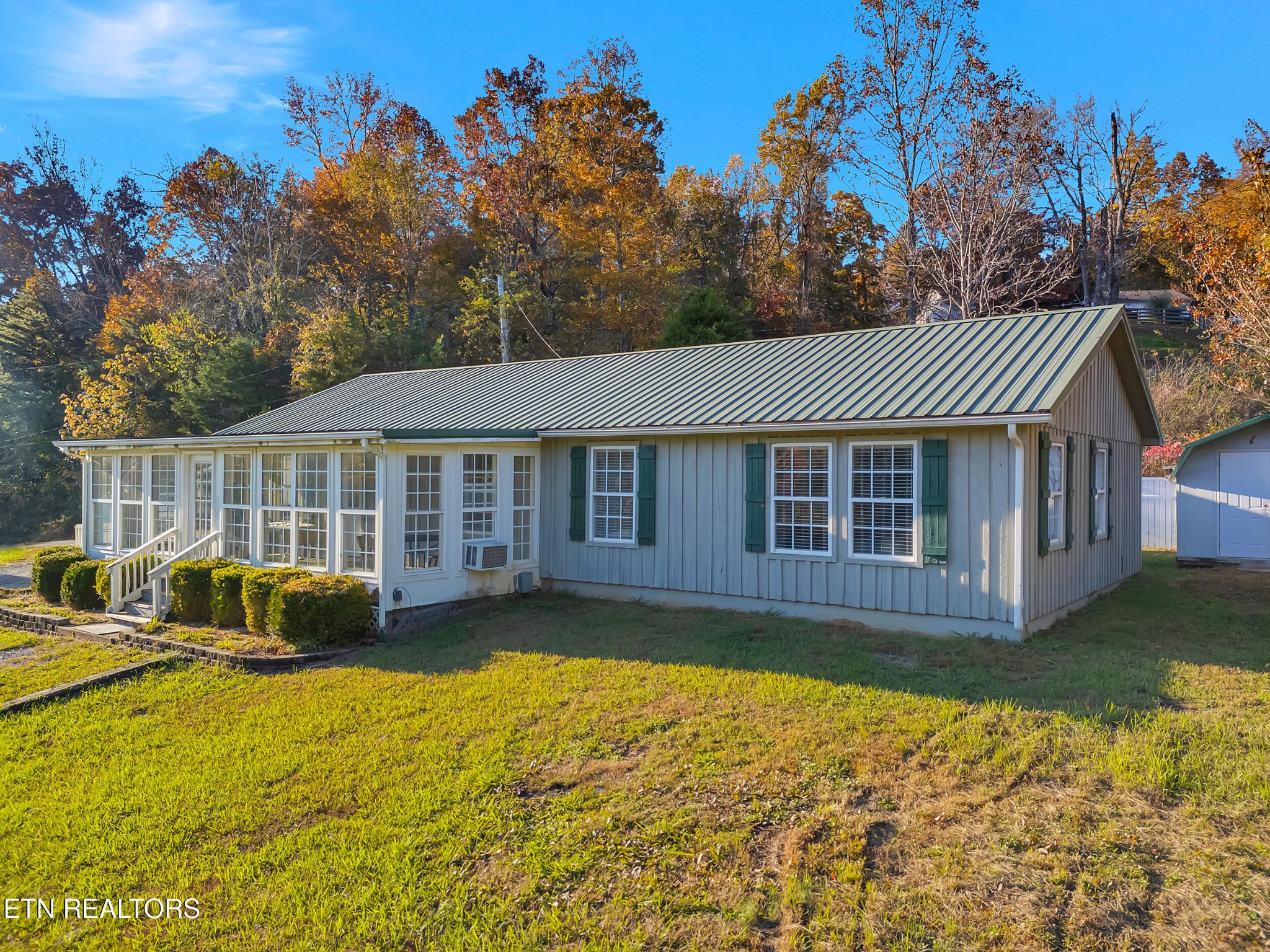9256 Hines Valley Road Lenoir City, TN 37771 - Photo 3 of 46 a front view of a house with garden
