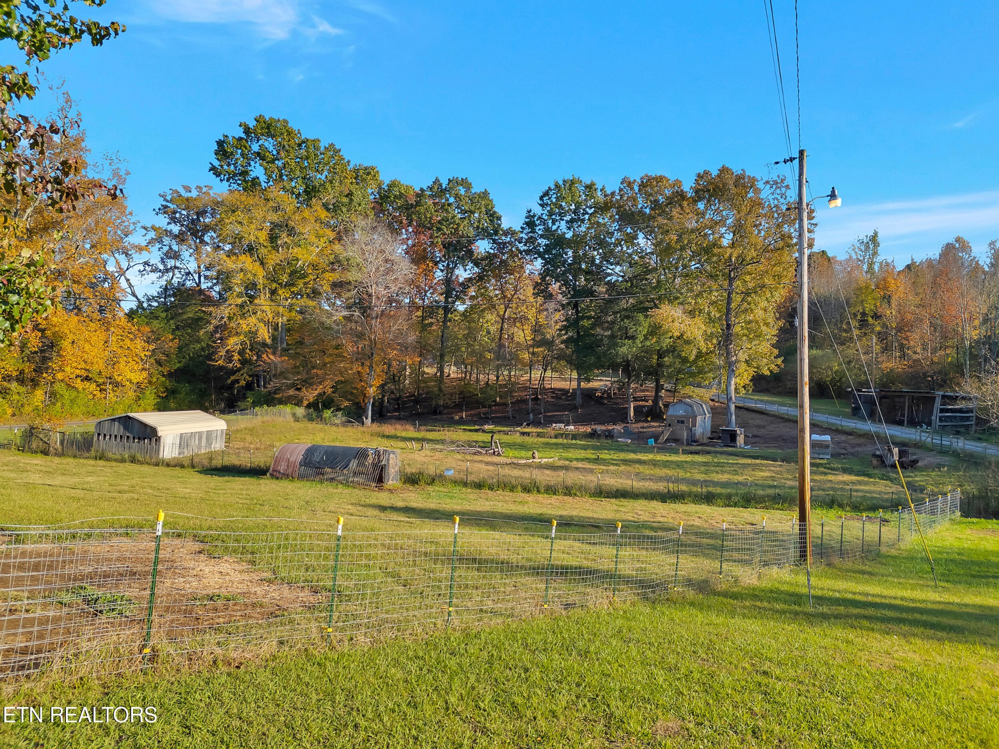 9256 Hines Valley Road Lenoir City, TN 37771 - Photo 38 of 46 a view of a swimming pool with an outdoor space and seating area