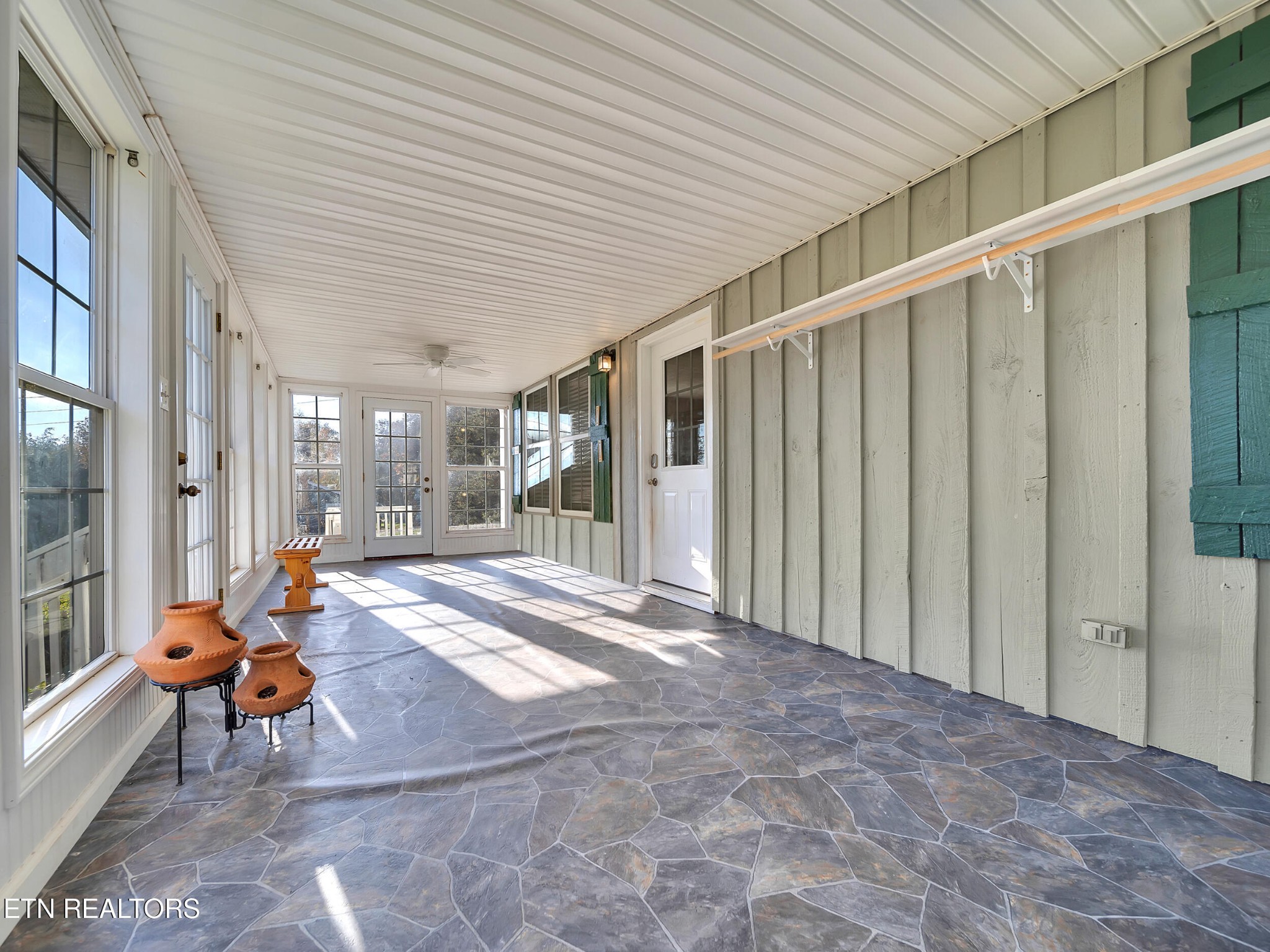 9256 Hines Valley Road Lenoir City, TN 37771 - Photo 7 of 46 a view of a patio with table and chairs
