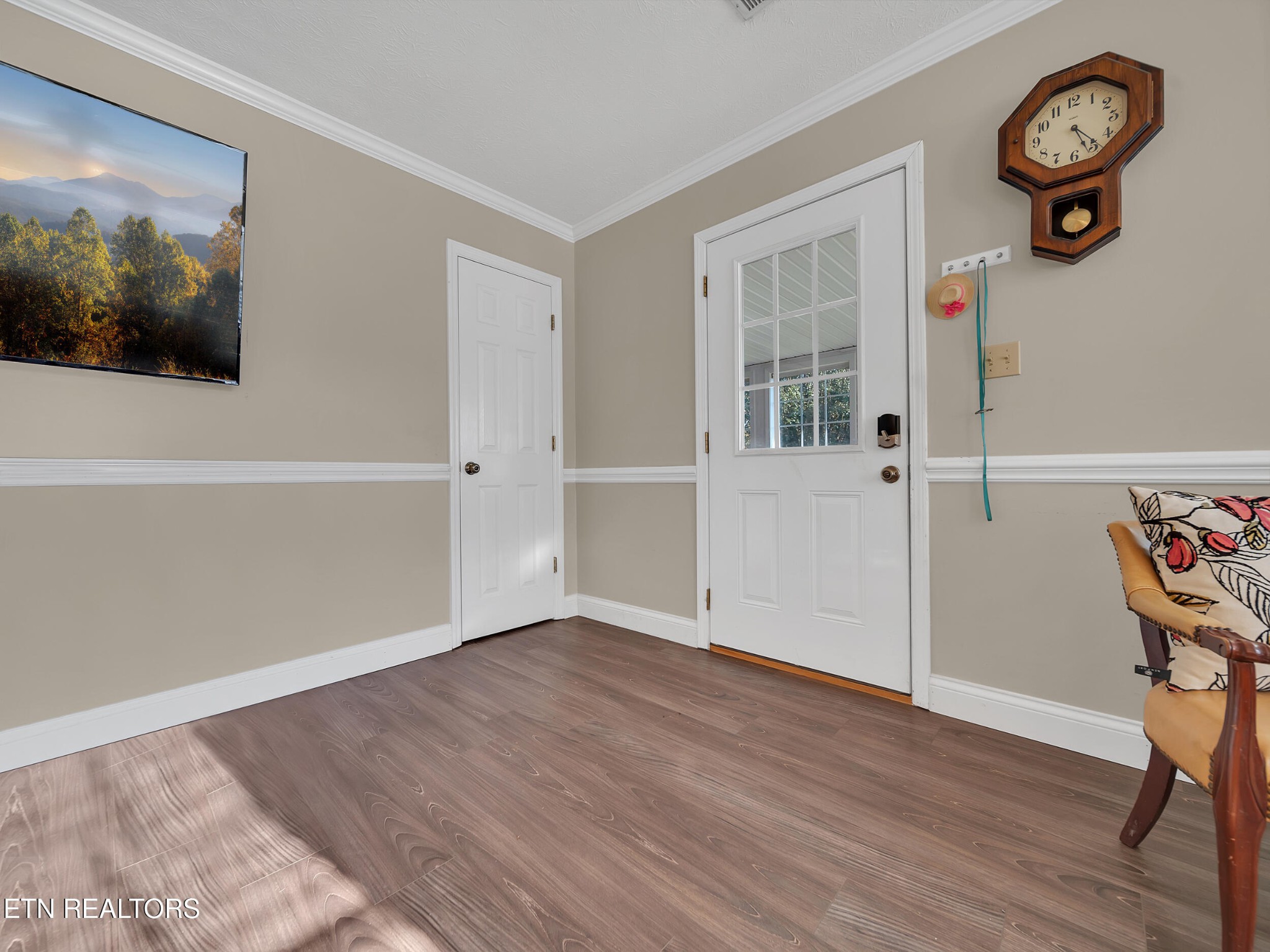 9256 Hines Valley Road Lenoir City, TN 37771 - Photo 8 of 46 a view of a room with wooden floor and white walls