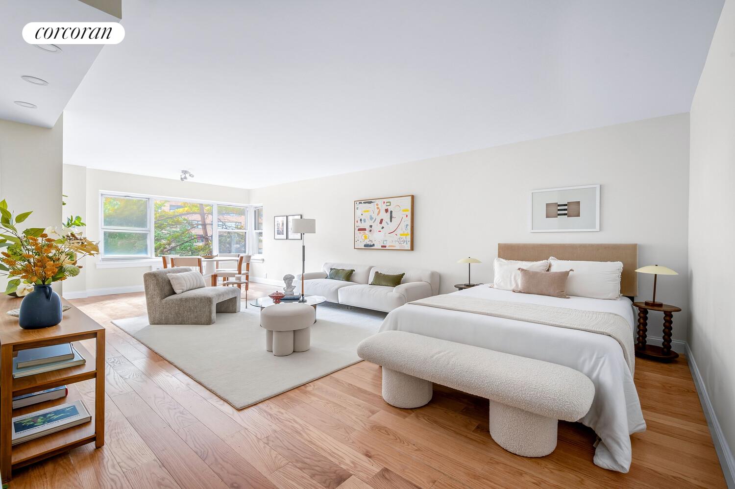 430 East 56th Street, Unit 3A Manhattan, NY 10022 - Photo 1 of 8 a living room with furniture and a wooden floor