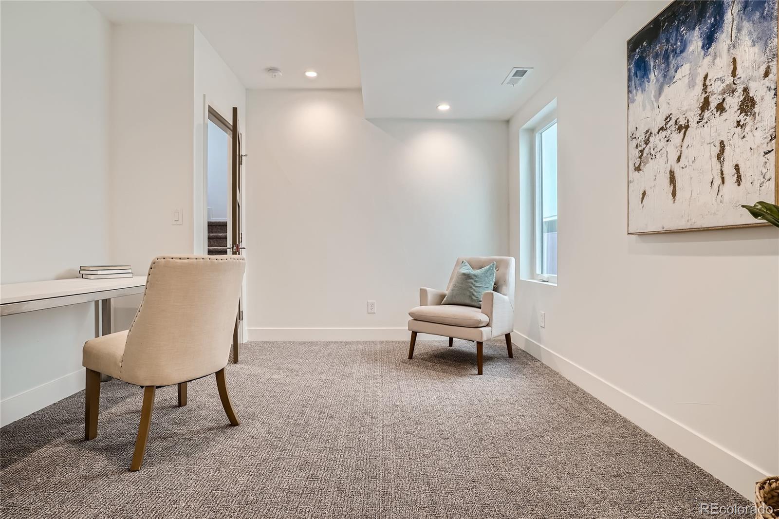 1255 Perry Street Denver, CO 80204 - Photo 11 of 28 a living room with furniture and a chair