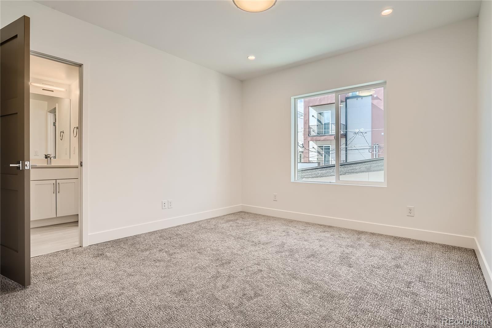 1255 Perry Street Denver, CO 80204 - Photo 14 of 28 an empty room with windows