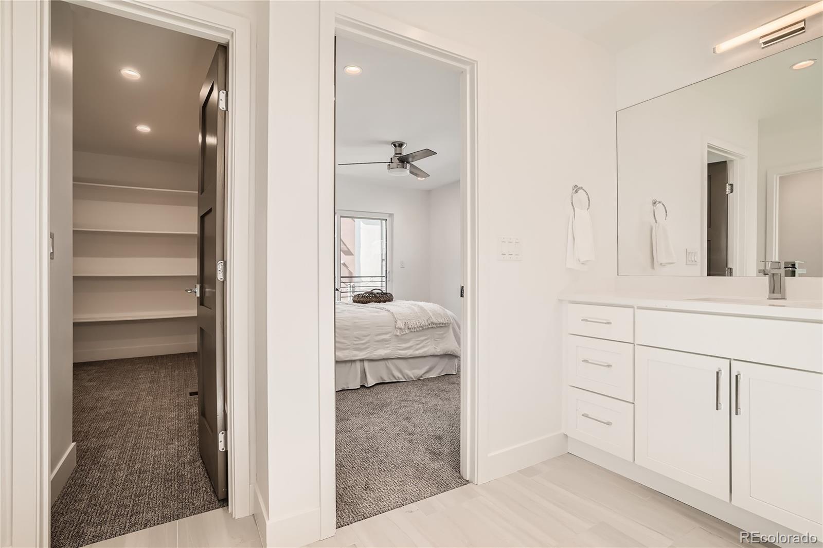 1255 Perry Street Denver, CO 80204 - Photo 20 of 28 a bathroom with a sink and a mirror