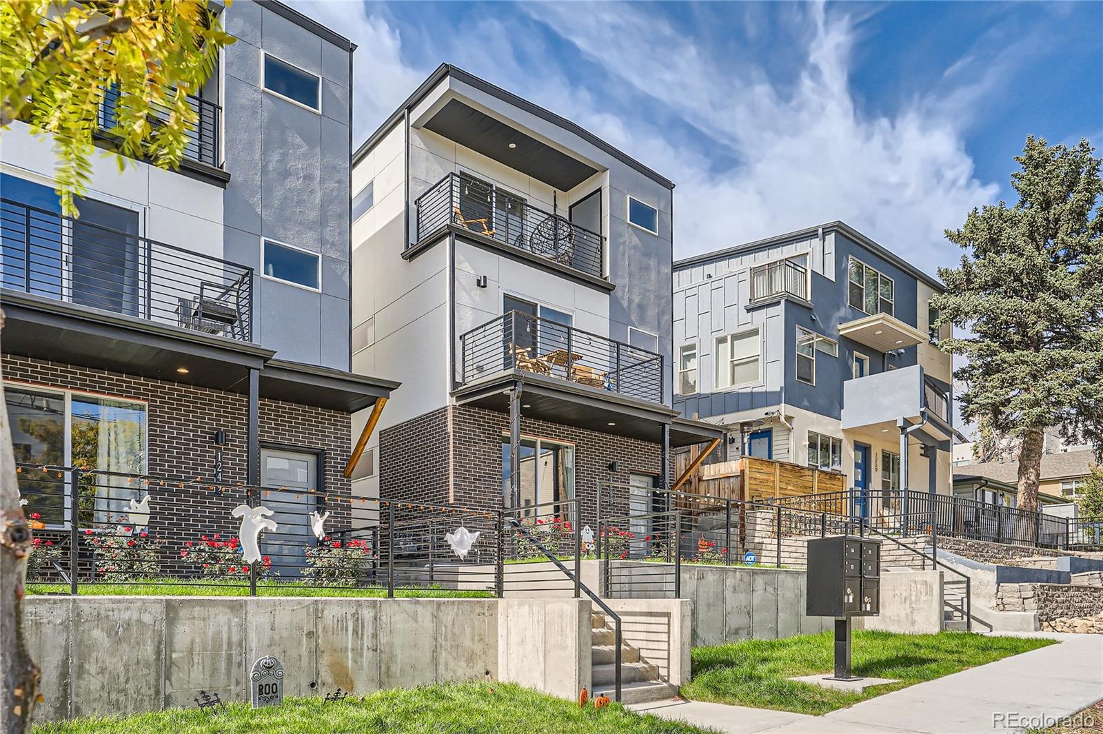 1255 Perry Street Denver, CO 80204 - Photo 2 of 28 a front view of a house with a yard