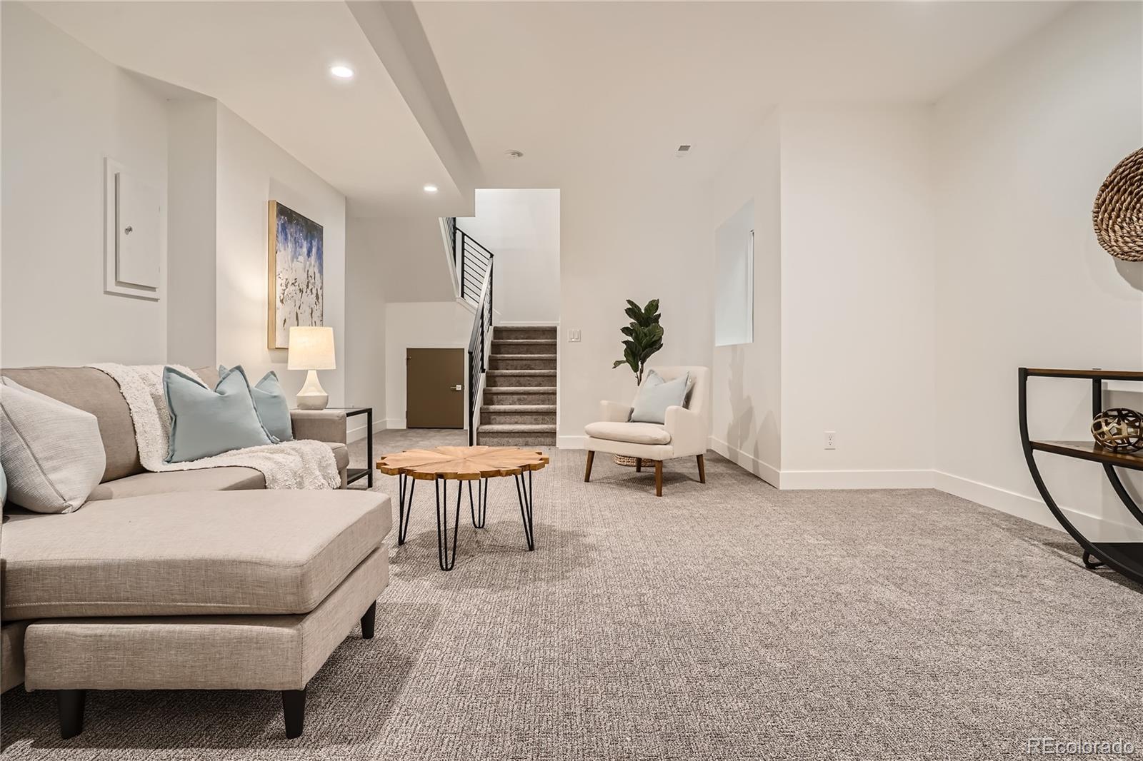 1255 Perry Street Denver, CO 80204 - Photo 23 of 28 a living room with furniture and a piano