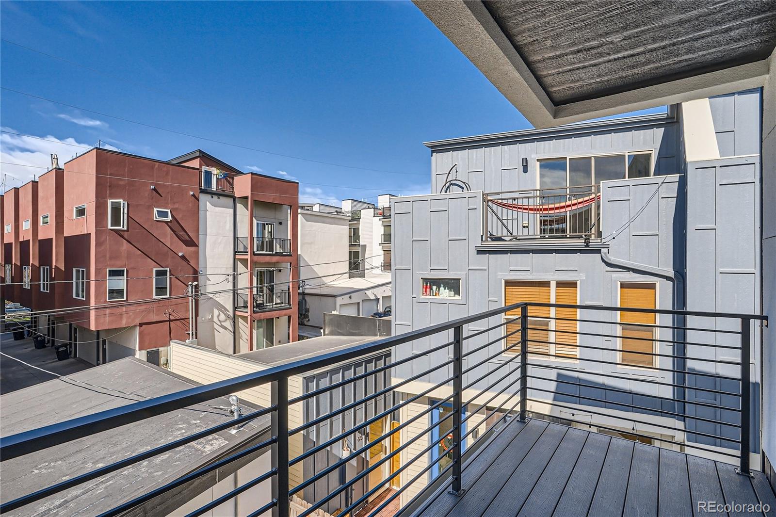 1255 Perry Street Denver, CO 80204 - Photo 25 of 28 a balcony view with wooden floor