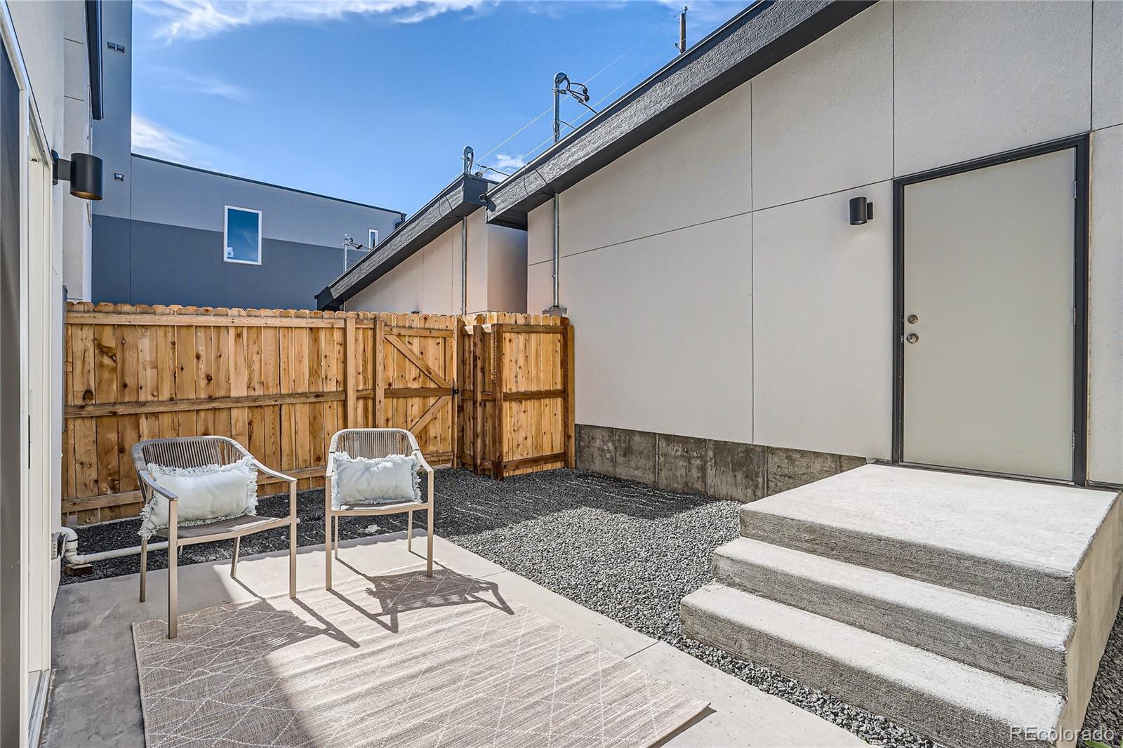1255 Perry Street Denver, CO 80204 - Photo 26 of 28 a outdoor space with lots of chairs and mirrors