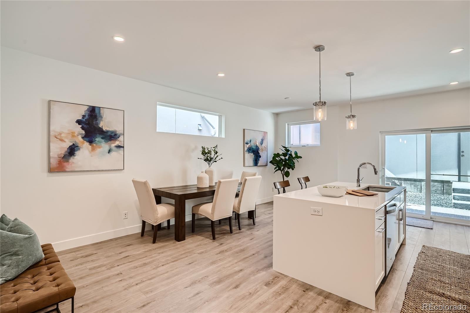 1255 Perry Street Denver, CO 80204 - Photo 5 of 28 a view of a dining room with furniture and wooden floor