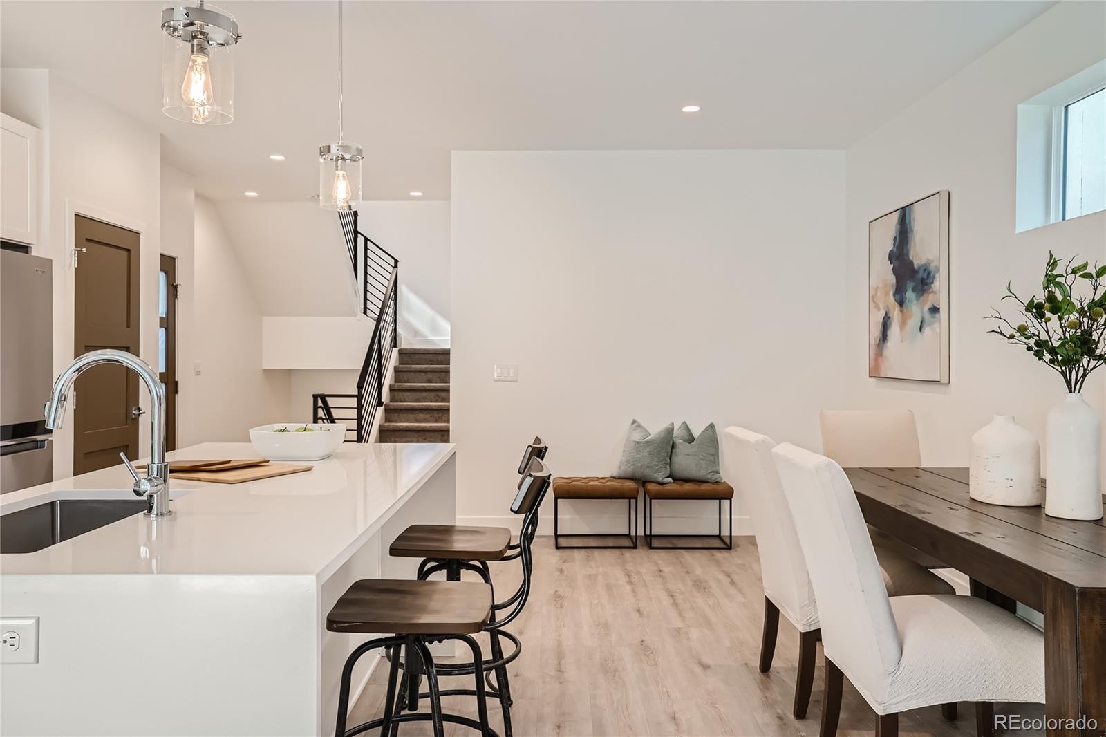 1255 Perry Street Denver, CO 80204 - Photo 8 of 28 a view of a dining room with furniture and wooden floor
