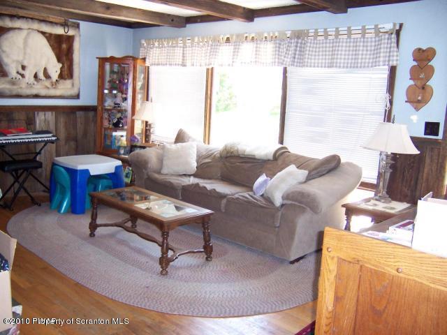 385 Butternut Road Newfoundland, PA 18445 - Photo 3 of 12 a living room with furniture and a large window