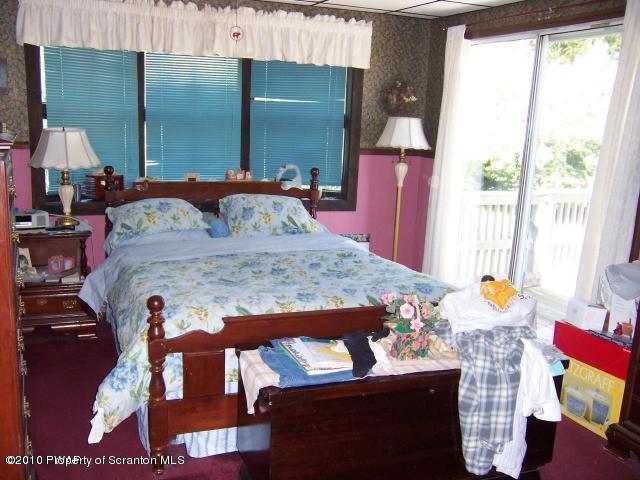 385 Butternut Road Newfoundland, PA 18445 - Photo 7 of 12 a bedroom with bed and window
