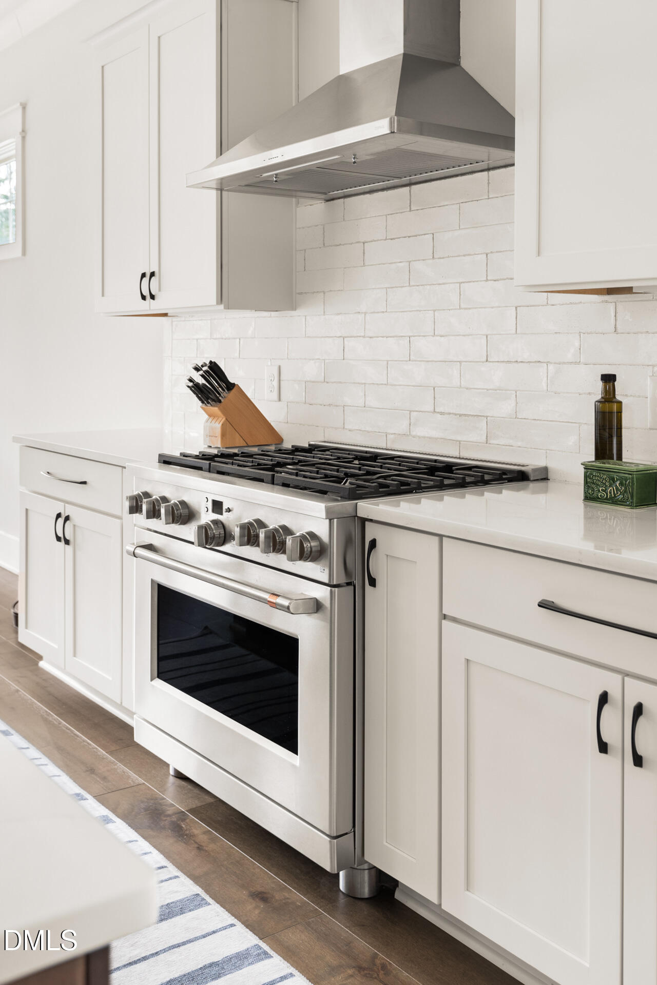 3025 Eden Harbor Court Raleigh, NC 27613 - Photo 16 of 41 a white stove top oven sitting inside of a kitchen