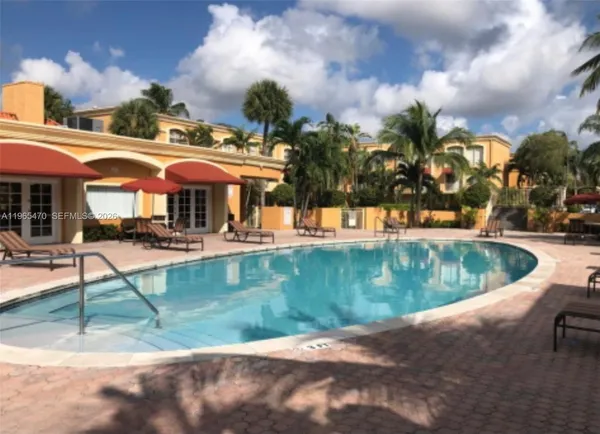 a view of a swimming pool with a patio
